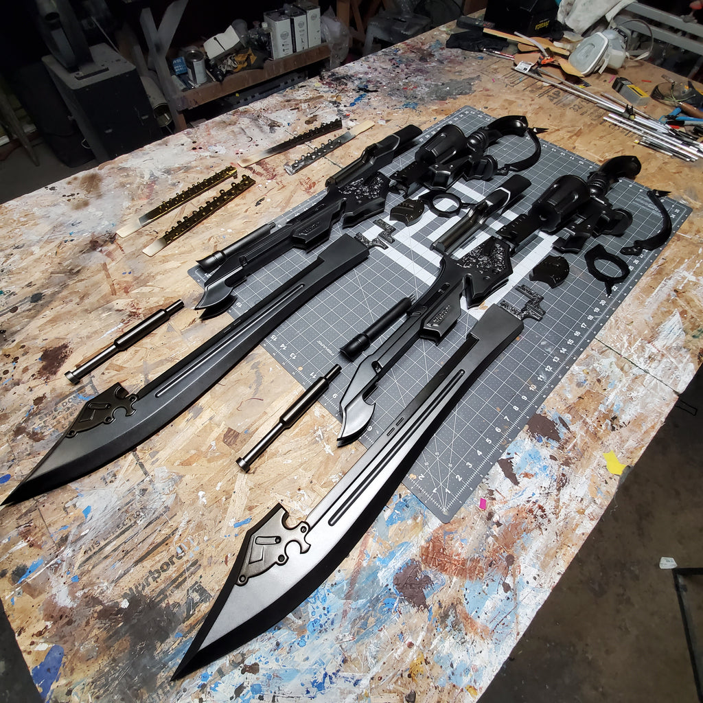 Long black sword with decorative elements on a workbench