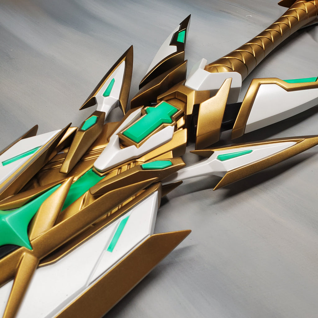 Close-up of a gold and green sword with a white sheath on a gray background
