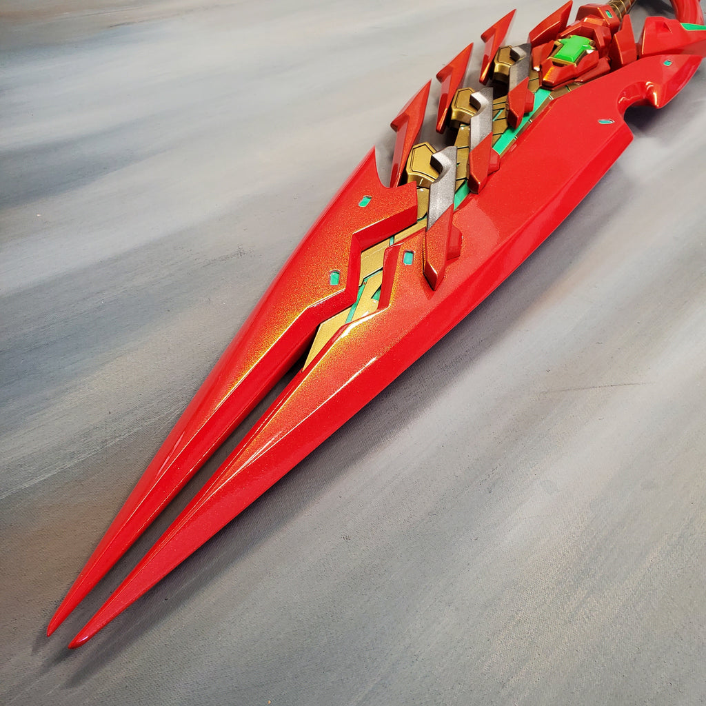 Red and gold futuristic sword on a metallic surface