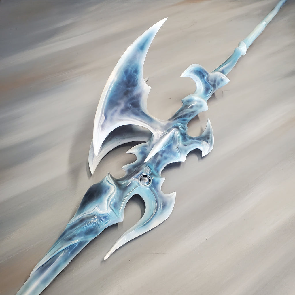 Decorative weapon with blue and white design on a beige background