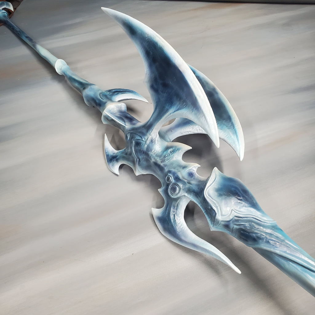 Fantasy axe with blue and white design on a gray background