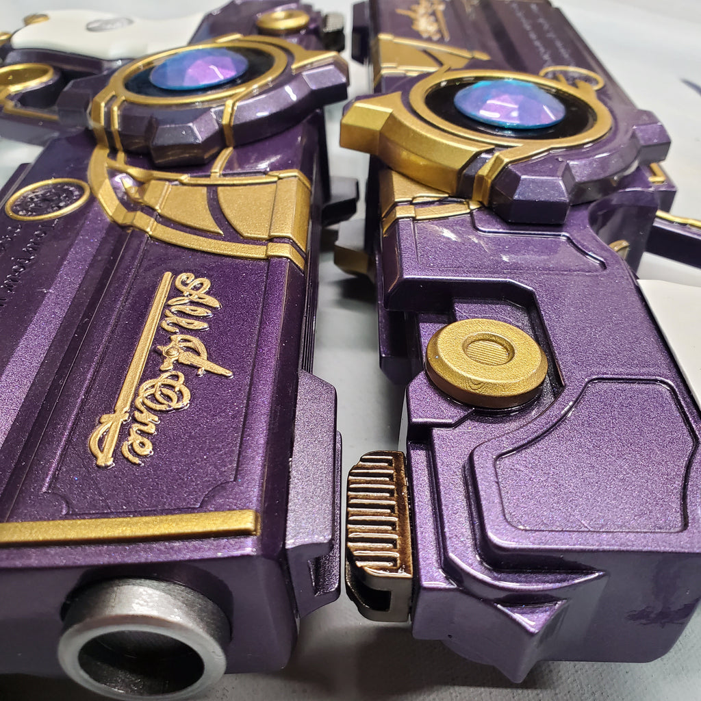 Close-up of a purple and gold robot toy with 'All in One' branding.