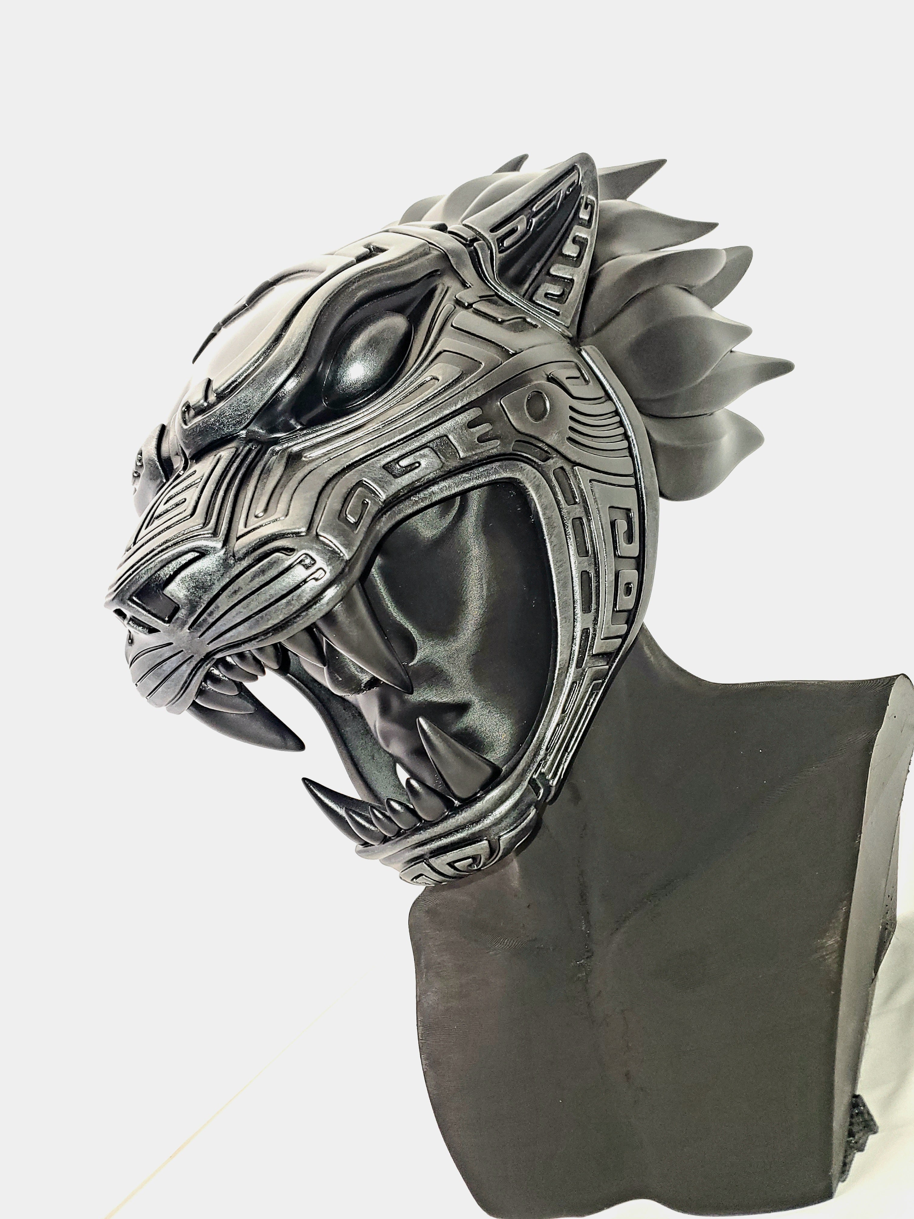 Metallic panther mask on a mannequin head against a white background