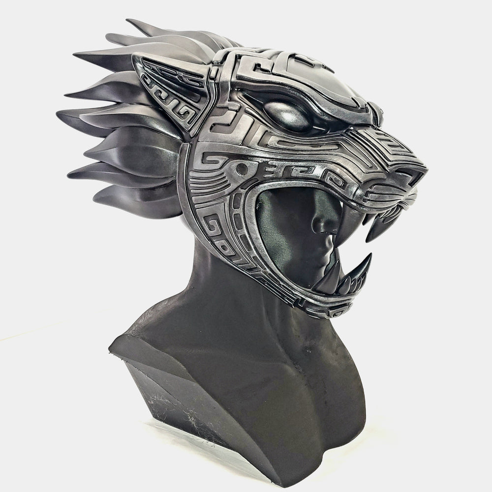 Decorative helmet with lion design on a white background
