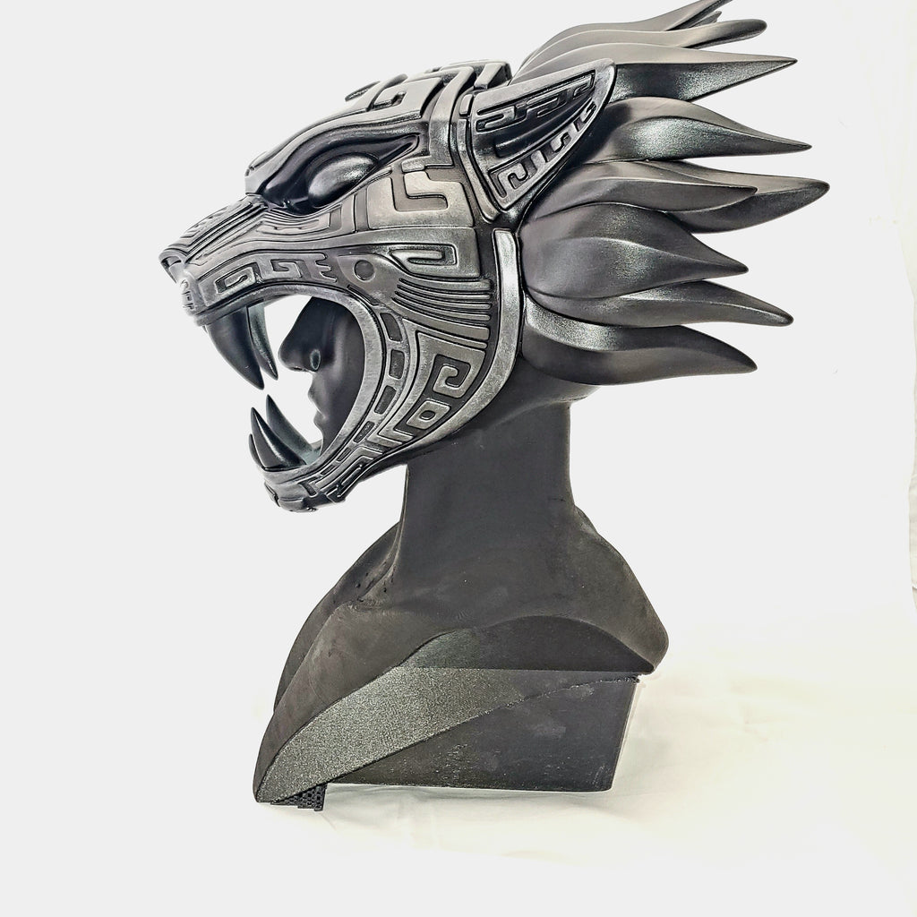 Decorative helmet with intricate design on a white background