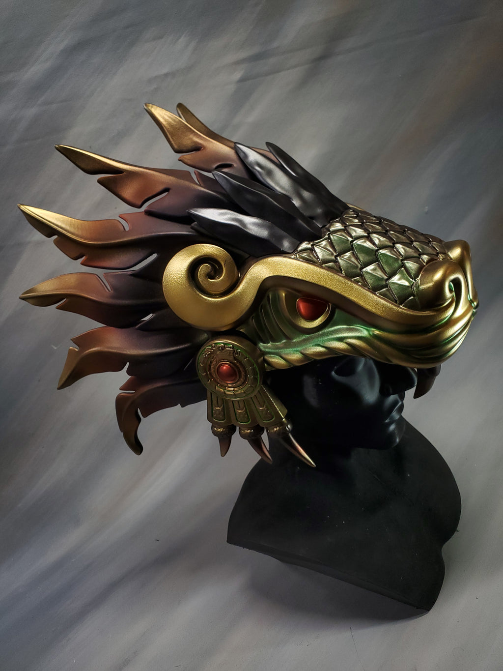 Decorative mask with intricate design on a gray background