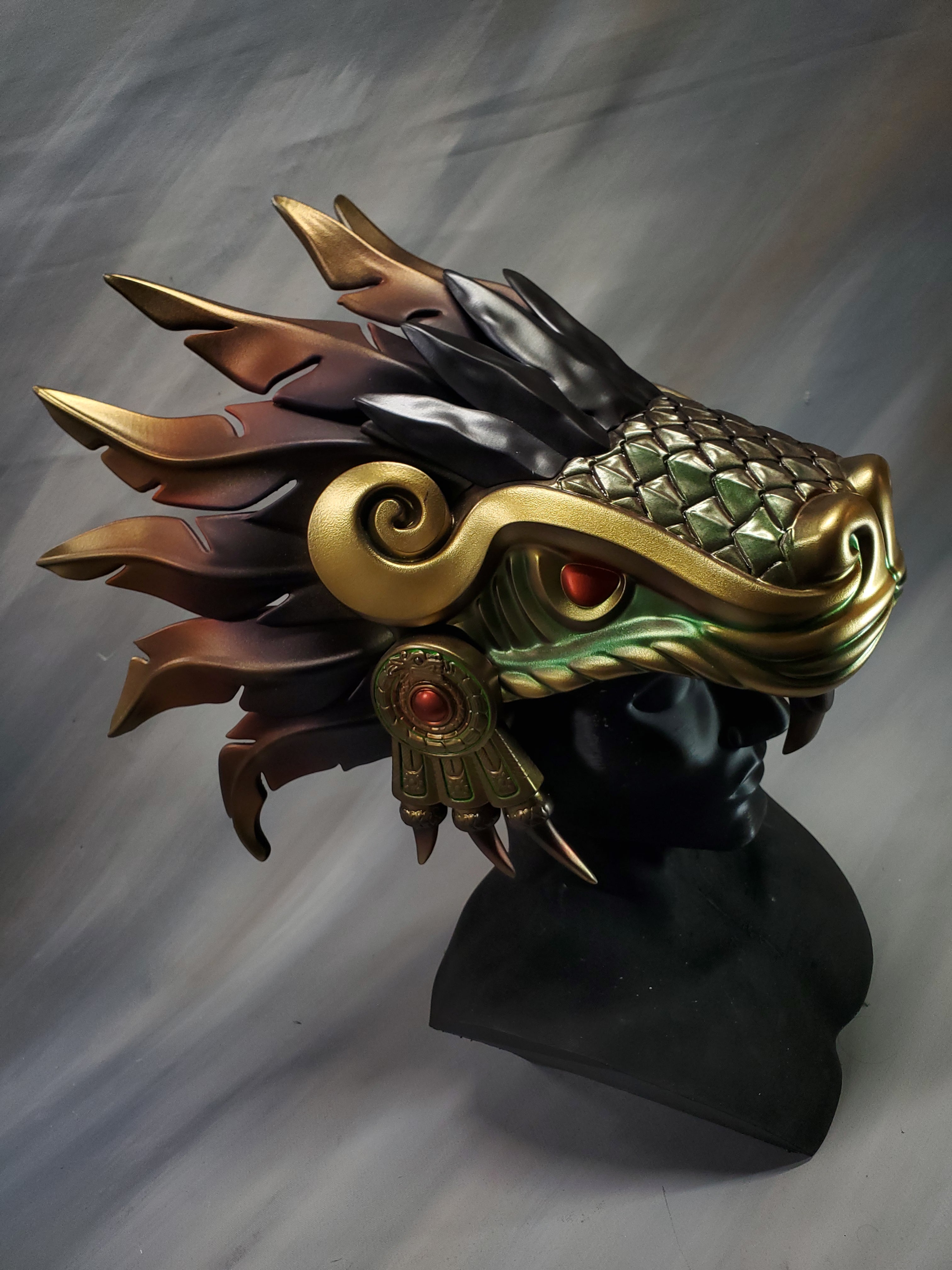 Decorative mask with intricate design on a gray background